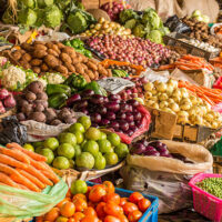 Colorful fruits and vegetables colorfully arranged at a local fruit and vegetable market in Nairobi, Kenya.